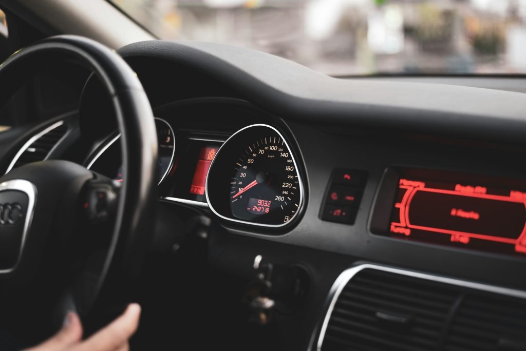 Dashboard warning lights indicating an electrical defect in a luxury vehicle